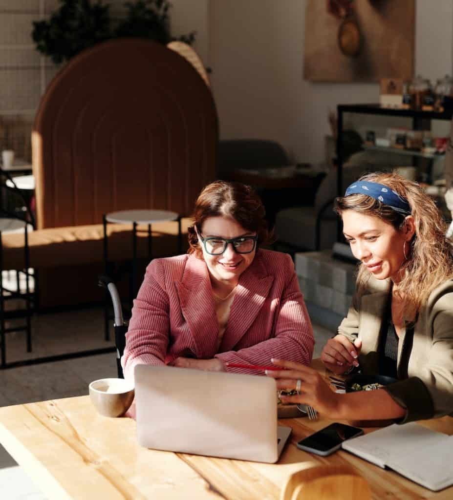 A woman being mentored by another woman.