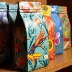 Create Impressive Packaging for Your Unique Presence! colorful-floral-tea-packaging-wooden-shelf